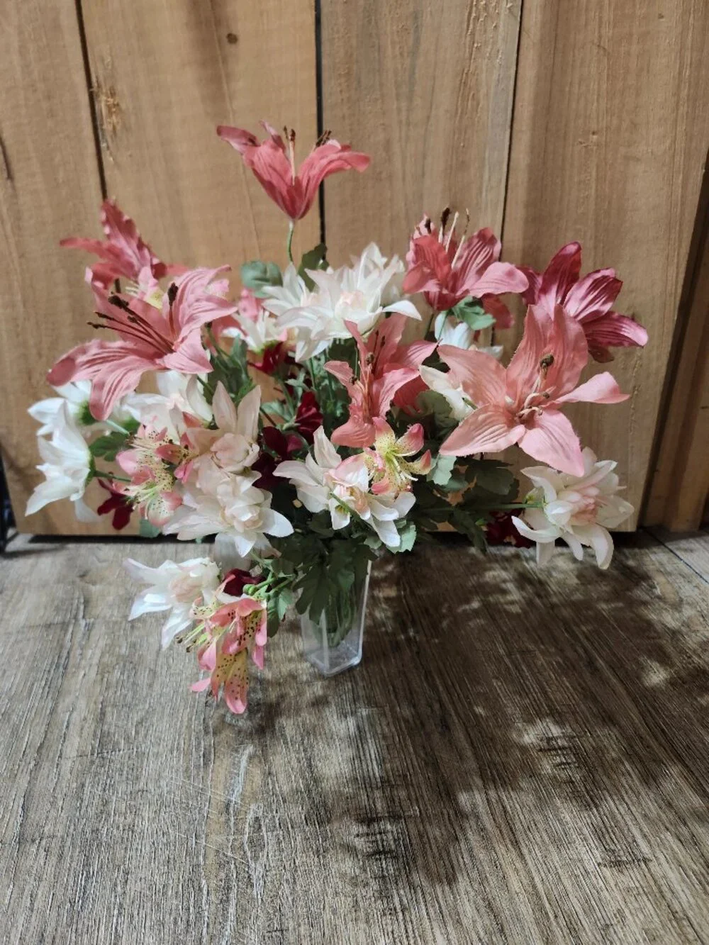 vintage floral arrangement of artificial flowers in small vase